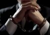 Hamas Cash Pipeline — Charity Boss Nabbed Businessperson in handcuffs with hands clasped