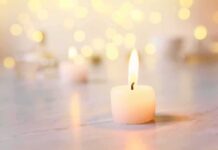 Baby Found Dead — Then More Remains white tealight candle with soft flame