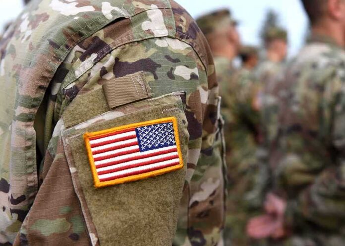 U.S. flag patch on a camouflage military uniform