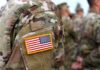 U.S. flag patch on a camouflage military uniform