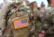 U.S. flag patch on a camouflage military uniform