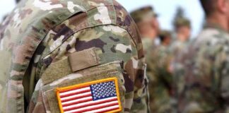 U.S. flag patch on a camouflage military uniform