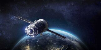 Satellite orbiting Earth over night side