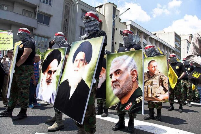 Protesters holding large portrait posters during a street march