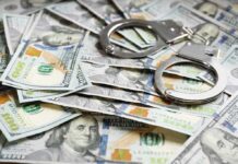 $100M Bounty Hunt Hits Cartel Royalty Handcuffs on scattered US hundred dollar bills