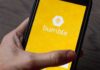 Women-First No More: Chaos or Relief? smartphone displaying the Bumble app splash screen