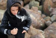 Vape Ban Passed, Cannabis Exempt — Huh? teenager in hoodie vaping among rocks