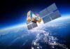 Planet Labs Goes Dark After Trump Push A satellite equipped with solar panels orbiting above the Earth