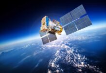 Planet Labs Goes Dark After Trump Push A satellite equipped with solar panels orbiting above the Earth