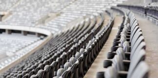 Empty stadium seats in curved rows
