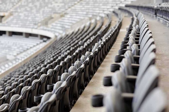 Empty stadium seats in curved rows