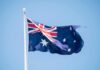 Wartime ‘Traitors’ Turn Aussie Winners Australian flag waving on a flagpole
