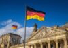 German flag flying above the Reichstag building