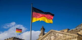 German flag flying above the Reichstag building