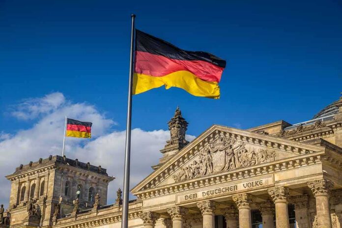 shutterstock_526234636 German flag flying above the Reichstag building