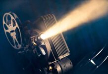 Buried Valor Resurfaces — Vietnam’s Ghost Unit Film projector casting a bright beam of light