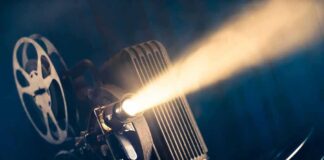 Film projector casting a bright beam of light