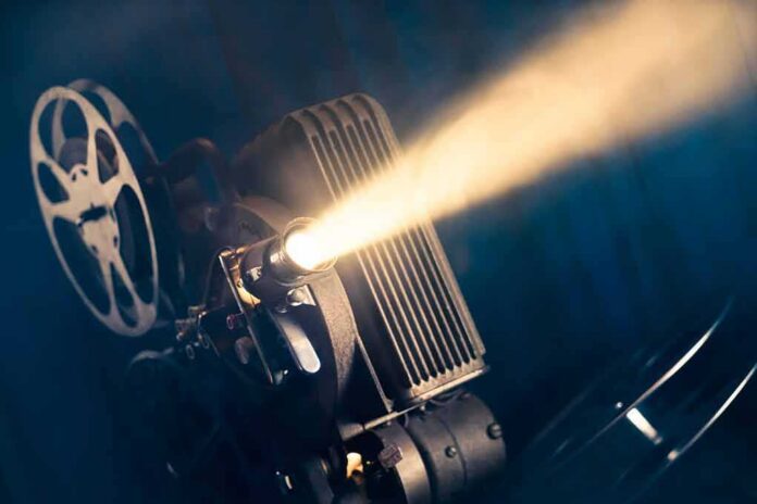 Film projector casting a bright beam of light