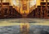 Church Crisis: Meeting Hints at Brutal Housecleaning Church interior with wooden pews facing ornate altar