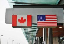 Canada Gaming U.S. Strike? – Trump Rhetoric Sparks Wild War Drill Canadian and American flags displayed at a border crossing