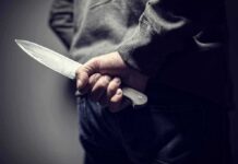 Student Center Melee – Police Swoop After Stabbing Frenzy person holding a large knife behind their back