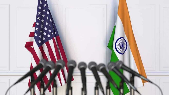 Flags of the USA and India at international meeting or conference. 3D Microphones in front of United States and India flags