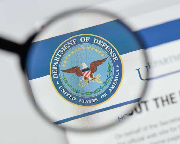 shutterstock_1170026380 magnifying glass focusing on U.S. Department of Defense seal
