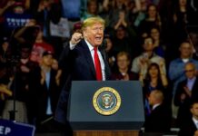 Trump’s $5,000 Pledge—What’s The Catch? Donald Trump speaking at a rally behind a presidential podium