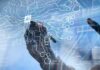 Altman Warns Bubble—Then Pitches Trillions hands interacting with a digital AI interface