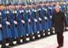 Vladimir Putin walks past an honor guard; Genaro García Luna and Darius Kilgo not visible