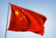 Blacklists Gut America’s Magnet Buildout Chinese national flag waving on a pole