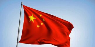 Chinese national flag waving on a pole