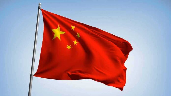 Chinese national flag waving on a pole