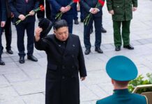 Man in black coat tipping hat during formal ceremony