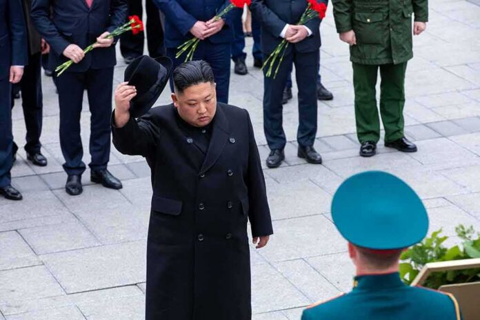 Man in black coat tipping hat during formal ceremony