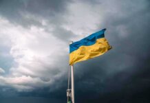 Ukrainian flag waving against a stormy sky