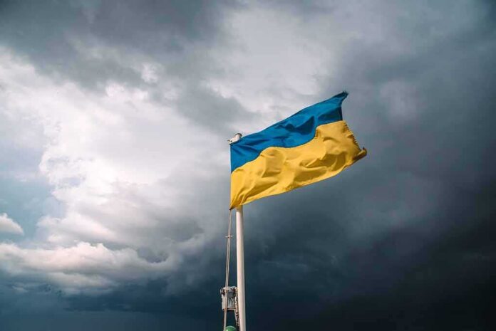 Ukrainian flag waving against a stormy sky