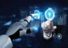 Military Taps ChatGPT, Grok—What’s Hidden? Robot hand and human hand touching digital interface