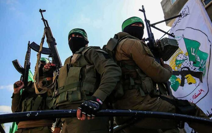armed masked men in military gear holding rifles