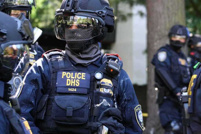 shutterstock_1801253857 Riot police officer in tactical gear with helmet and visor