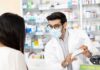 Medicare Power Play Backfires – Doctors Sound Alarm Pharmacist wearing mask explains medication to customer