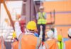 Make More In America—With Michigan Hands construction workers raising fists during a safety briefing