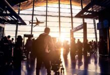Sky Turns Black – Drone War Hits Saudi Airport Airport terminal crowd at sunset with airplane silhouette outside