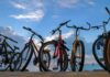 Eligibility Black Hole — Women’s Field Blindsided Bicycles lined up by the seaside at sunset