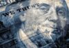 close-up of a US hundred-dollar bill portrait and microprint details