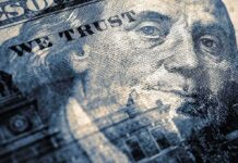 close-up of a US hundred-dollar bill portrait and microprint details