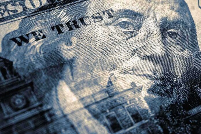 shutterstock_2147296729 close-up of a US hundred-dollar bill portrait and microprint details