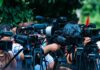 Demolition By Neglect? Wright Icon Imperiled TV news cameras crowding together at an outdoor event