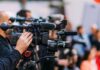 Zero-Drama Throne Flip Stuns Watchers Video cameras on tripods at a media event