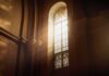 Secret Accord Renewed — Who Picks Bishops Now? sunlit stained glass window in a church interior